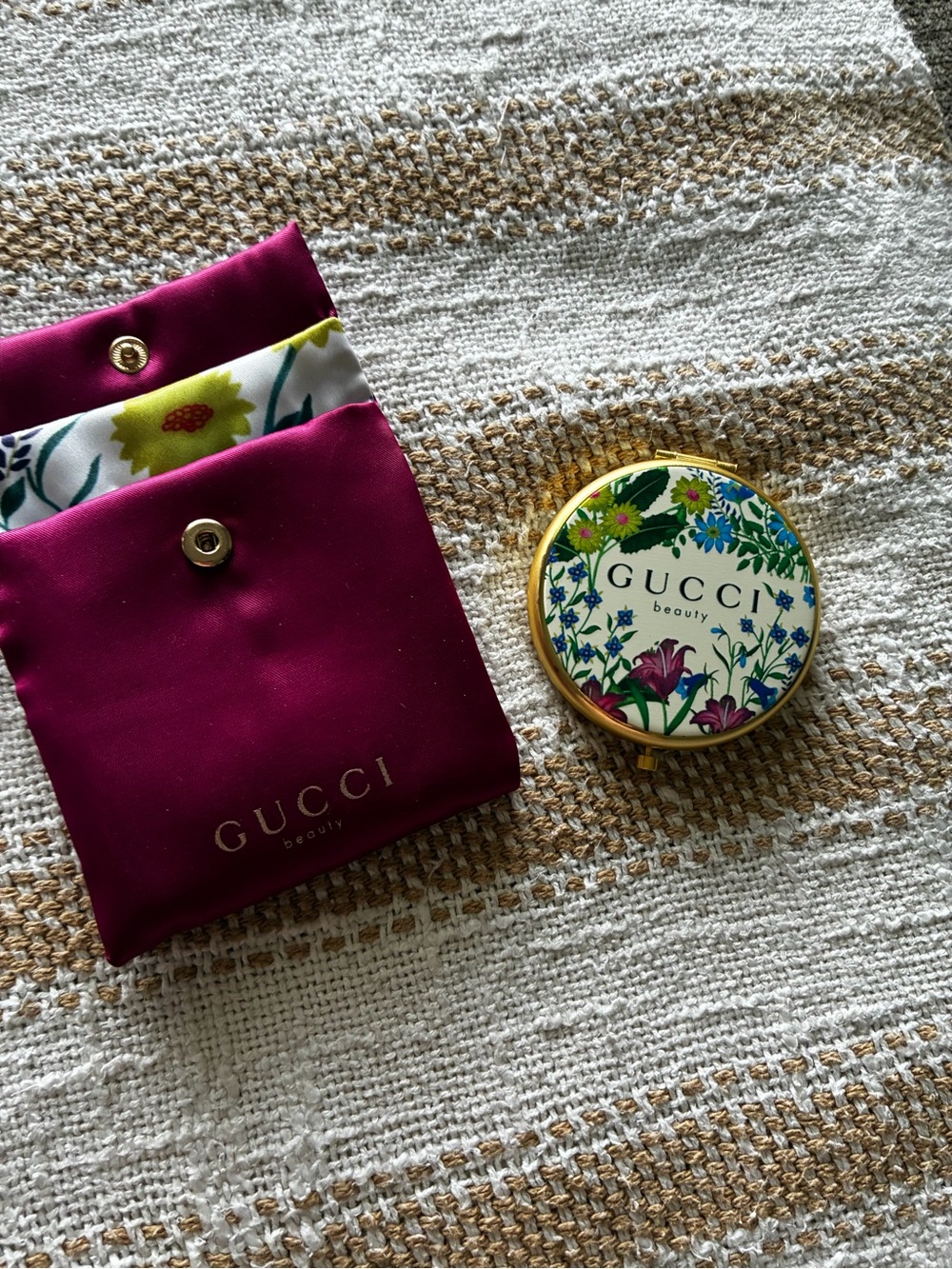 Gucci gold floral compact with magenta pouch